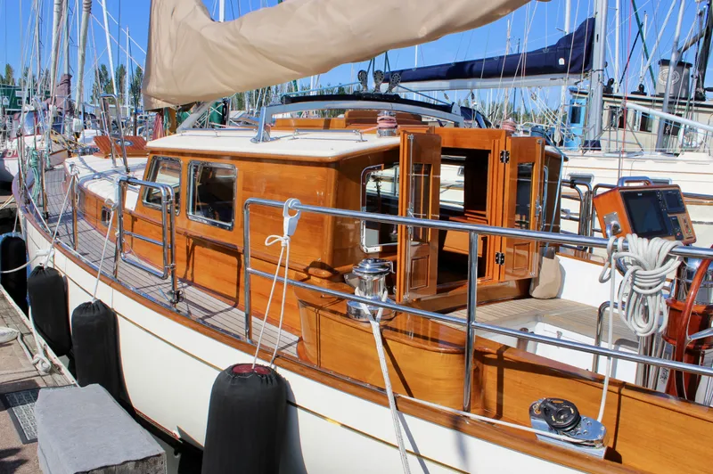 Slide: The Image of Cape George 45 sailboat, 2018 model, docked with wooden cabin and polished fittings. - 10