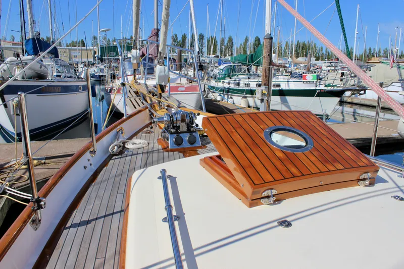 Slide: The Image of Sailboat docked at marina, Cape George 45, 2018 model, with wooden deck and hatch. - 12