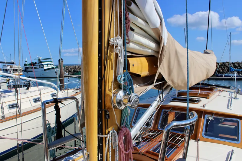 Slide: The Image of Sailboat deck view of 2018 Cape George 45 in marina, featuring mast and rigging. - 20