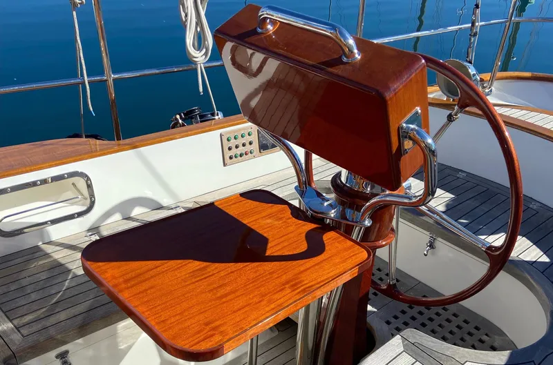 Slide: The Image of Cockpit of 2018 Cape George 45 sailboat with wooden helm and table. - 29