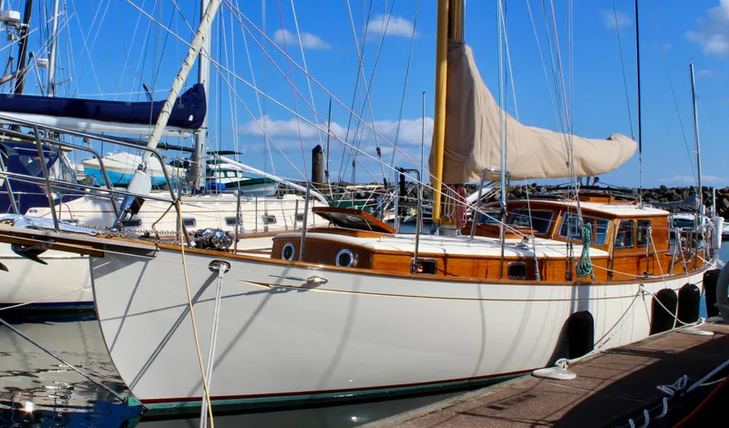 Slide: The Image of 2018 Cape George 45 sailboat docked at marina under clear blue sky. - 3