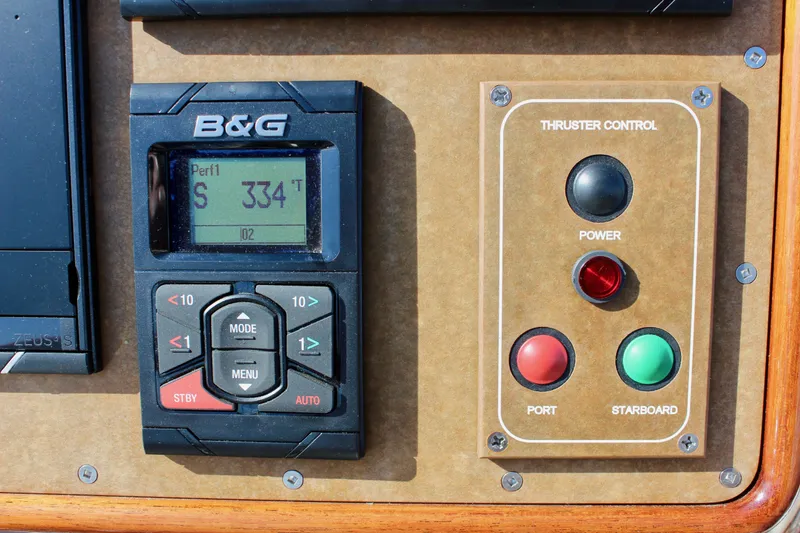 Slide: The Image of Control panel of a 2018 Cape George 45 sailboat with navigation and thruster controls. - 33