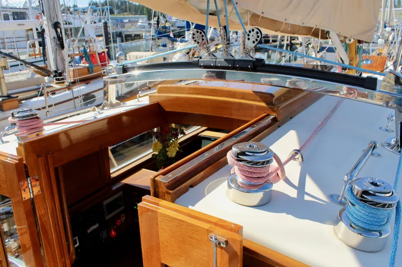 Slide: The Image of 2018 Cape George 45 sailboat deck with winches and wooden cabin details. - 38