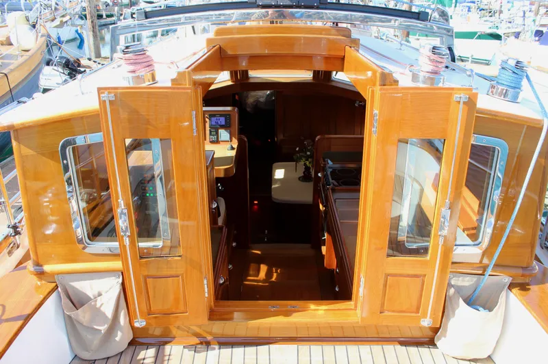 Slide: The Image of Cape George 45 sailboat interior entrance with wooden doors, showcasing elegant craftsmanship, 2018 model. - 41