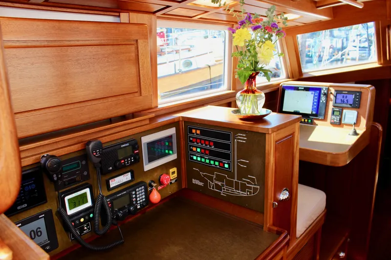 Slide: The Image of Interior of 2018 Cape George 45 yacht with navigation equipment and floral arrangement. - 43