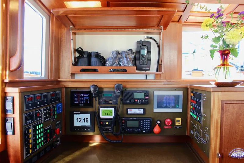 Slide: The Image of Navigation equipment on a 2018 Cape George 45 yacht, featuring control panels and communication devices. - 45