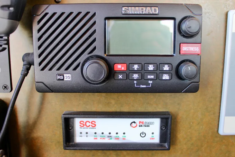 Slide: The Image of Simrad RS35 marine radio and SCS P4 Dragon DR-2400 on Cape George 45, 2018 model. - 48