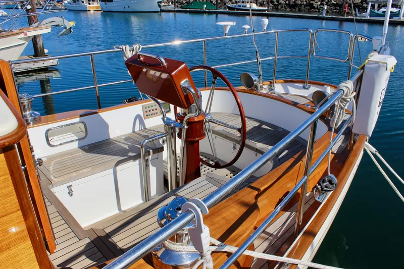 Slide: The Image of Cockpit of 2018 Cape George 45 sailboat with wooden accents and steering wheel. - 7