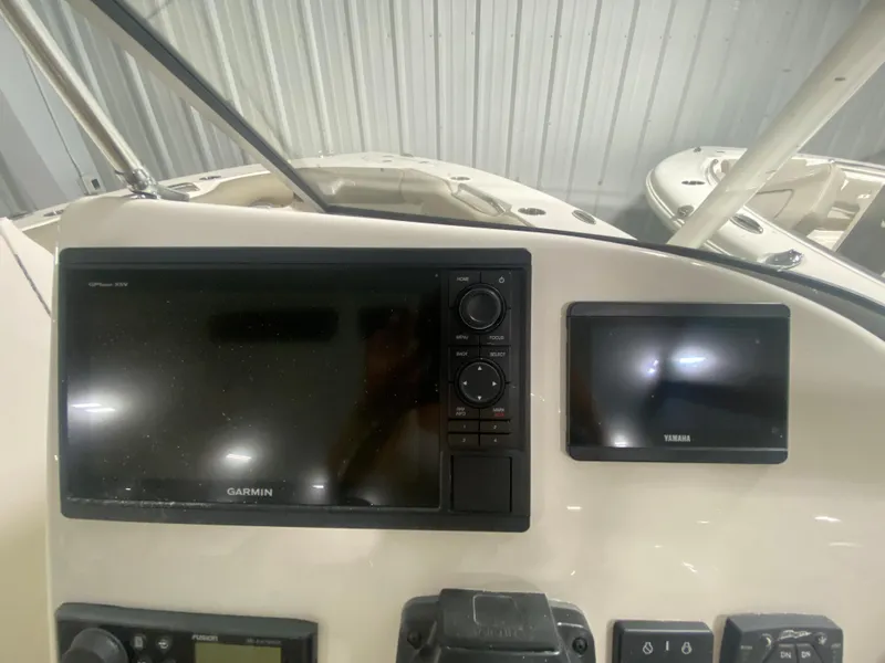 Slide: The Image of 2024 Key West 239 DFS dashboard with Garmin and Yamaha displays. - 15