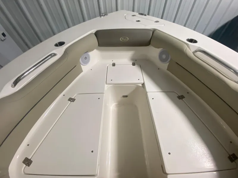 Slide: The Image of 2024 Key West 239 DFS boat interior with storage compartments and seating. - 25