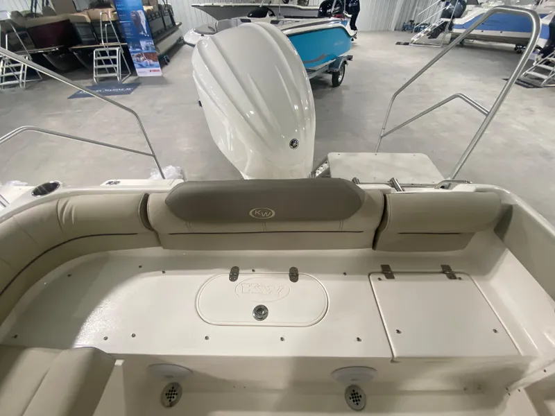Slide: The Image of 2024 Key West 239 DFS boat interior with seating and storage compartments. - 4