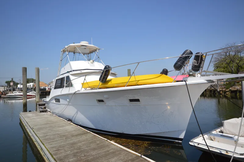 The Image of 1973 Hatteras 45 Convertible yacht docked at marina. - 0