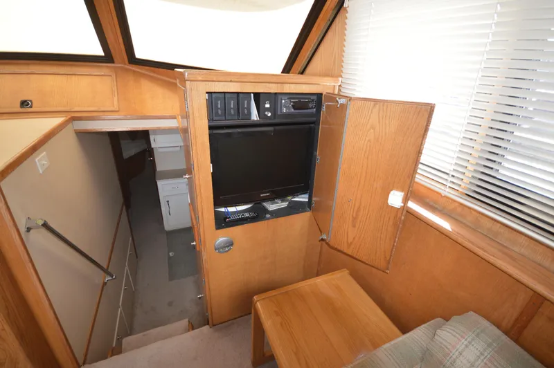 Slide: The Image of Interior of 1973 Hatteras 45 Convertible yacht with TV cabinet and stairs. - 17