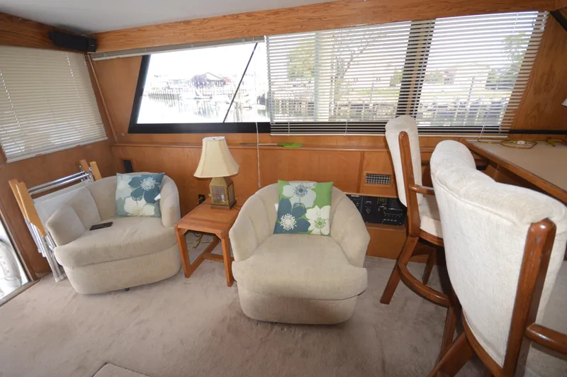 Slide: The Image of Interior of 1973 Hatteras 45 Convertible yacht with cozy seating area. - 27