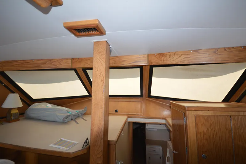 Slide: The Image of Interior cabin of a 1973 Hatteras 45 Convertible boat with wooden finishes. - 29