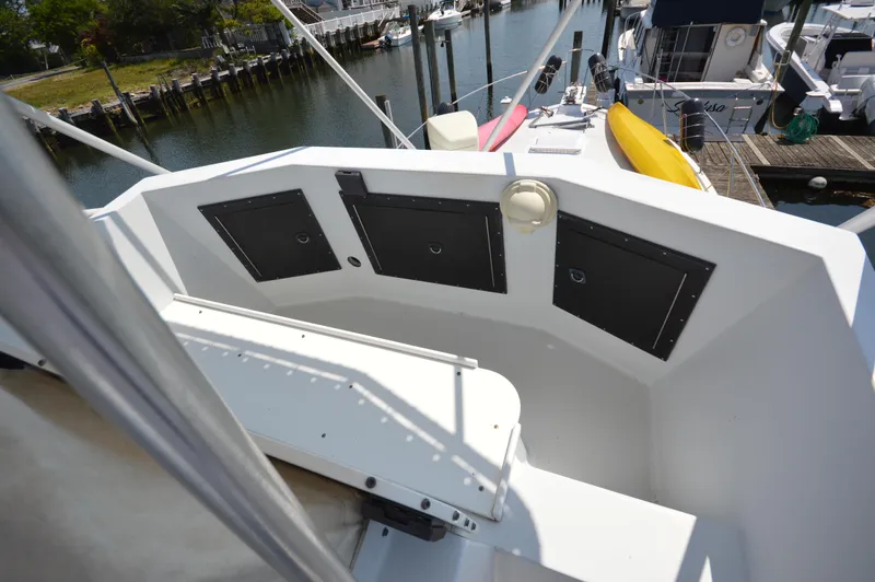 Slide: The Image of 1973 Hatteras 45 Convertible boat deck with storage compartments and seating. - 5