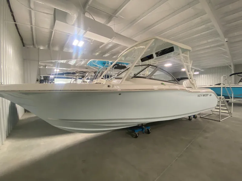 Slide: The Image of 2024 Key West 239 DFS boat in indoor showroom. - 1