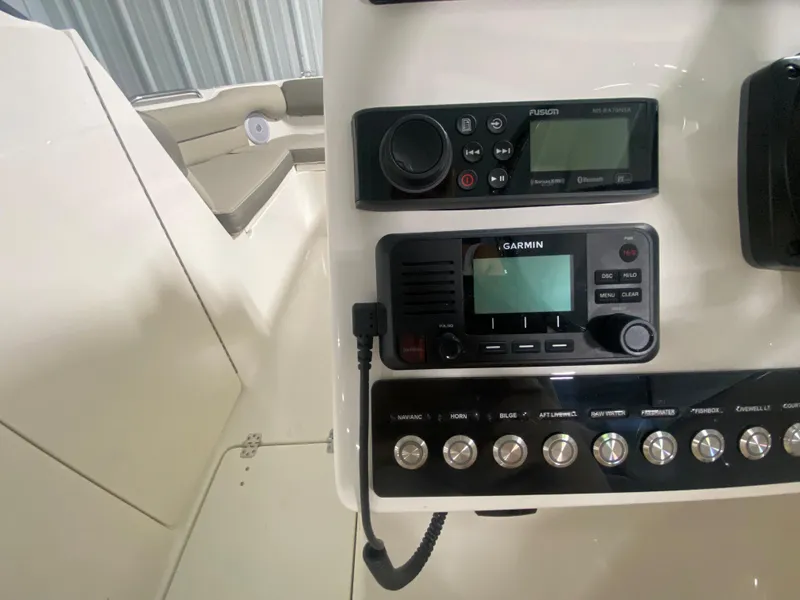 Slide: The Image of Control panel of a 2024 Key West 239 DFS boat with Garmin electronics. - 16