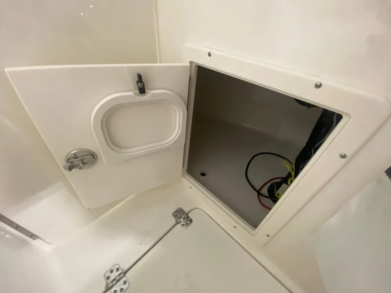 Slide: The Image of 2024 Key West 239 DFS storage compartment with open hatch. - 22