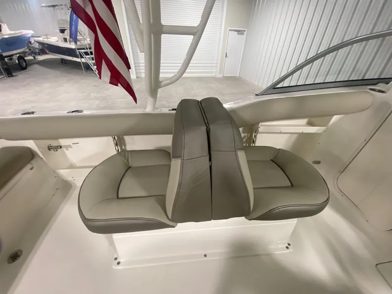 Slide: The Image of 2024 Key West 239 DFS boat with dual seating in a showroom. - 8