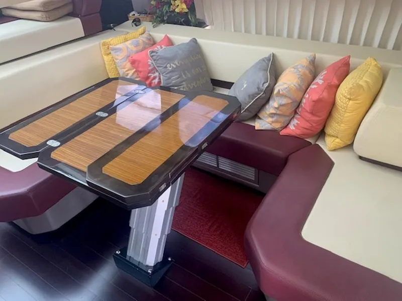 Slide: The Image of Interior of a 2008 Marquis 40 SC with stylish table and cushions. - 10