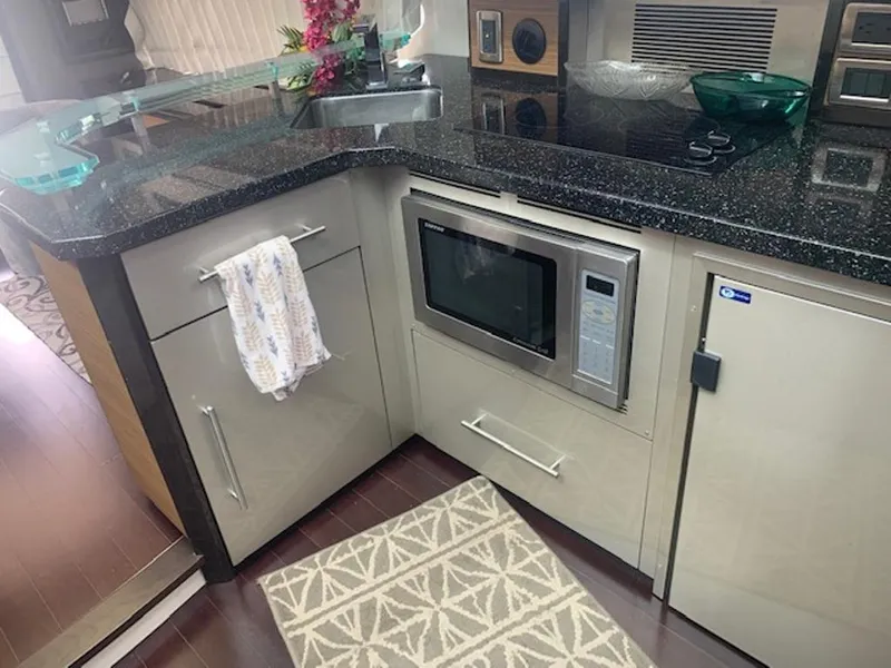 Slide: The Image of Kitchen area in a 2008 Marquis 40 SC yacht. - 12