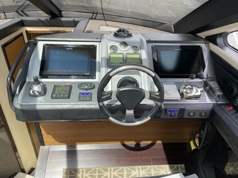 Slide: The Image of Helm of 2008 Marquis 40 SC yacht featuring modern navigation systems. - 4