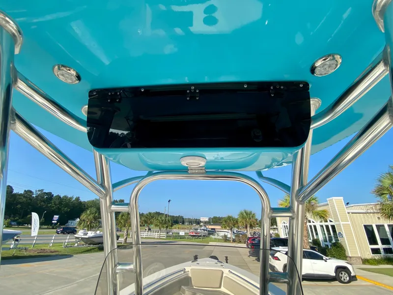 Slide: The Image of 2023 Key West 239 FS boat with blue T-top and stainless steel frame. - 14