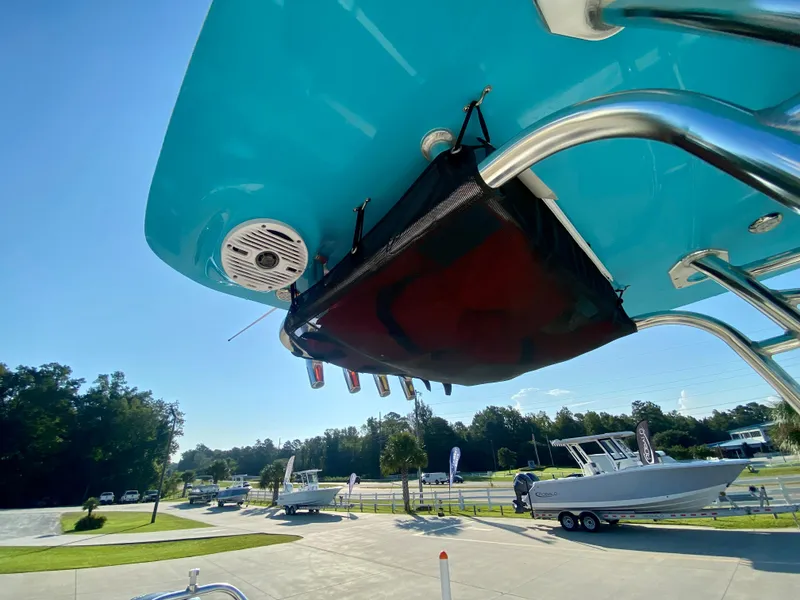 Slide: The Image of 2023 Key West 239 FS boat with blue T-top and rod holders. - 16