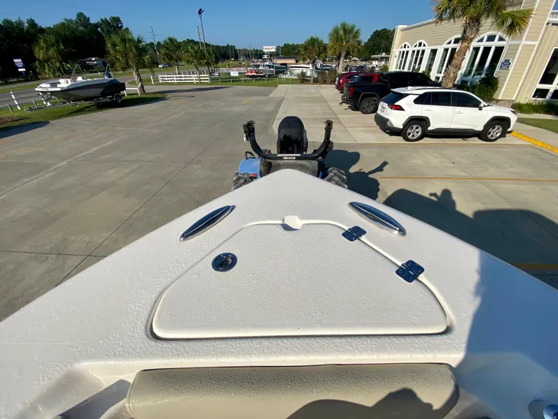 Slide: The Image of 2023 Key West 239 FS boat in parking lot, rear view. - 25