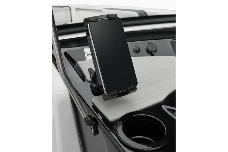 Slide: The Image of Smartphone holder on the dashboard of a 2024 Yamaha Boats SX220. - 2