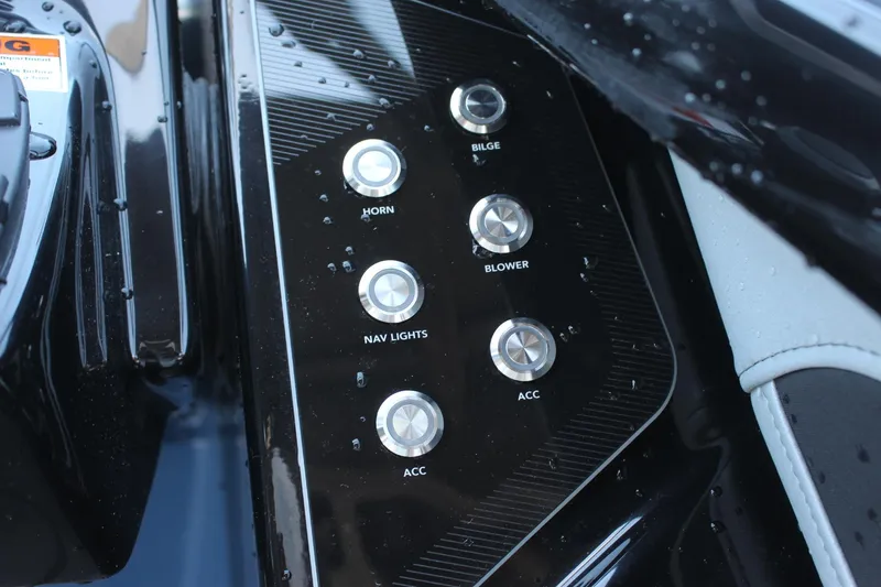 Slide: The Image of Control panel of 2023 Yamaha Boats 255XD with buttons for horn, bilge, blower, and lights. - 10