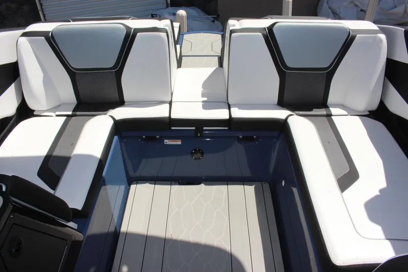 Slide: The Image of 2023 Yamaha Boats 255XD interior seating area with modern design and comfortable upholstery. - 14