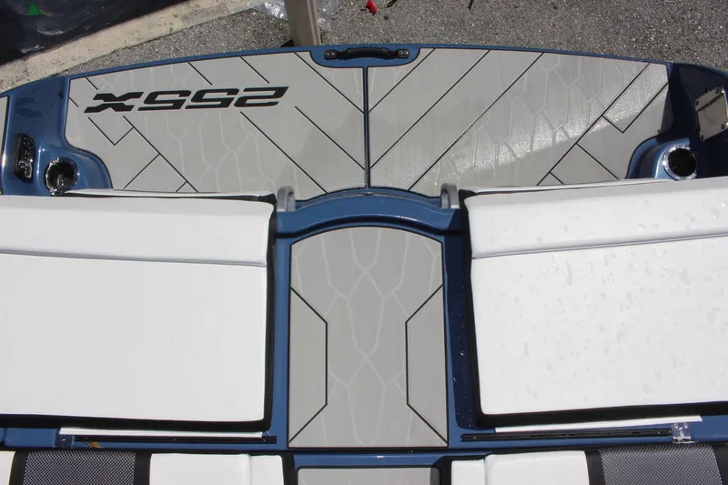 Slide: The Image of 2023 Yamaha Boats 255XD swim platform with cushioned seating. - 16