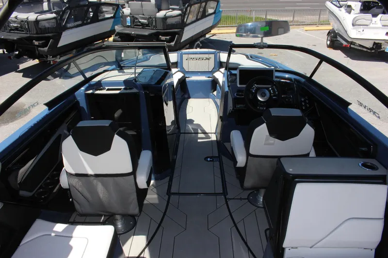 Slide: The Image of 2023 Yamaha Boats 255XD interior cockpit view with modern seating and dashboard. - 4
