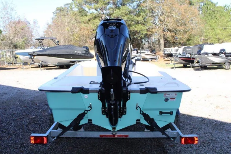 Slide: The Image of 2024 Mako Pro Skiff 13 CC boat on trailer, rear view. - 2