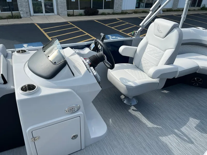 Slide: The Image of 2024 Lowe SS 210 WT boat interior with captain's chair and control console. - 10