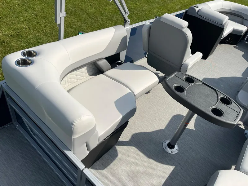 Slide: The Image of 2024 Lowe SS 210 WT pontoon boat interior with seating and table. - 16