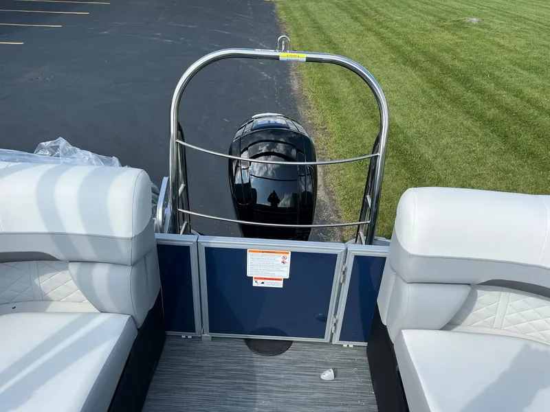 Slide: The Image of 2024 Lowe SS 210 WT pontoon boat, rear seating and outboard motor. - 20