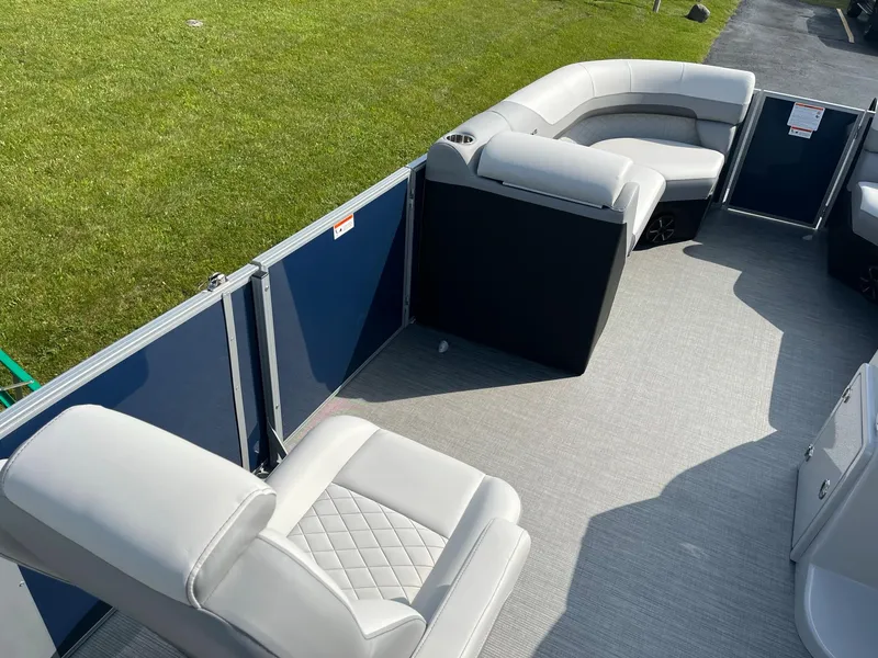 Slide: The Image of 2024 Lowe SS 210 WT pontoon boat interior with plush seating. - 22