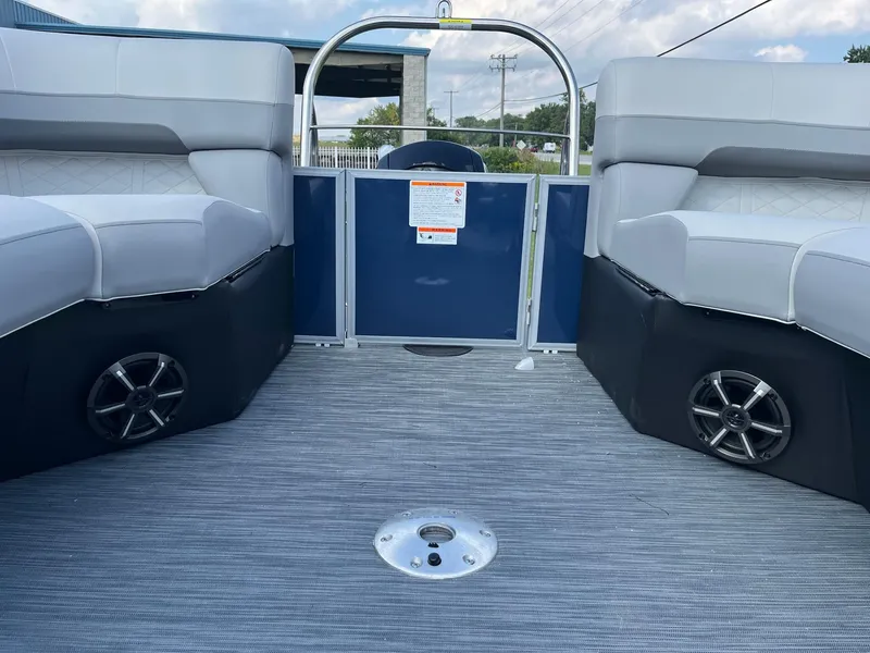 Slide: The Image of 2024 Lowe SS 210 WT pontoon boat interior with gray seating and flooring. - 25