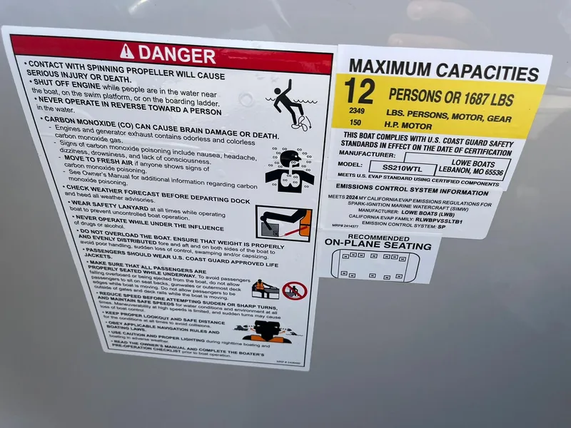 Slide: The Image of 2024 Lowe SS 210 WT boat safety and capacity warning labels, 12 persons or 1687 lbs. - 30