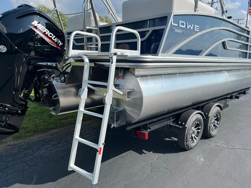Slide: The Image of 2024 Lowe SS 210 WT pontoon boat with Mercury outboard engine and rear ladder. - 4