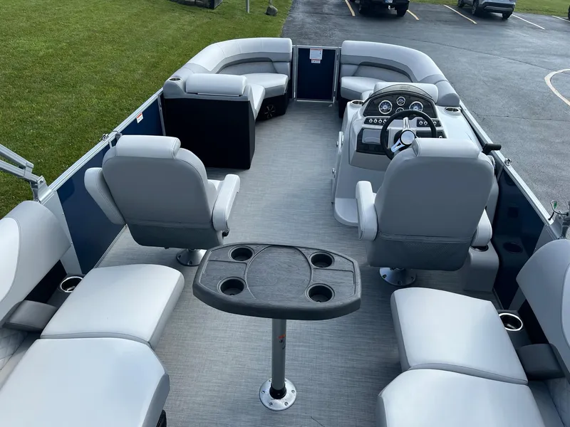 Slide: The Image of 2024 Lowe SS 210 WT pontoon boat interior with seating and control console. - 6
