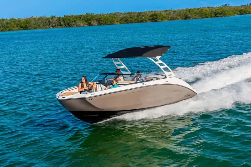 Slide: The Image of 2023 Yamaha Boats 252SD cruising on clear blue water. - 3
