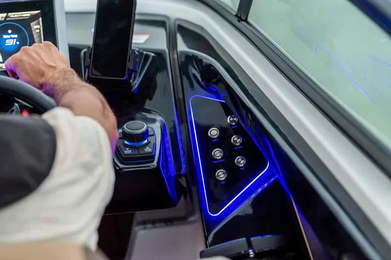 Slide: The Image of 2023 Yamaha Boats 252SD dashboard with illuminated controls and touchscreen display. - 7