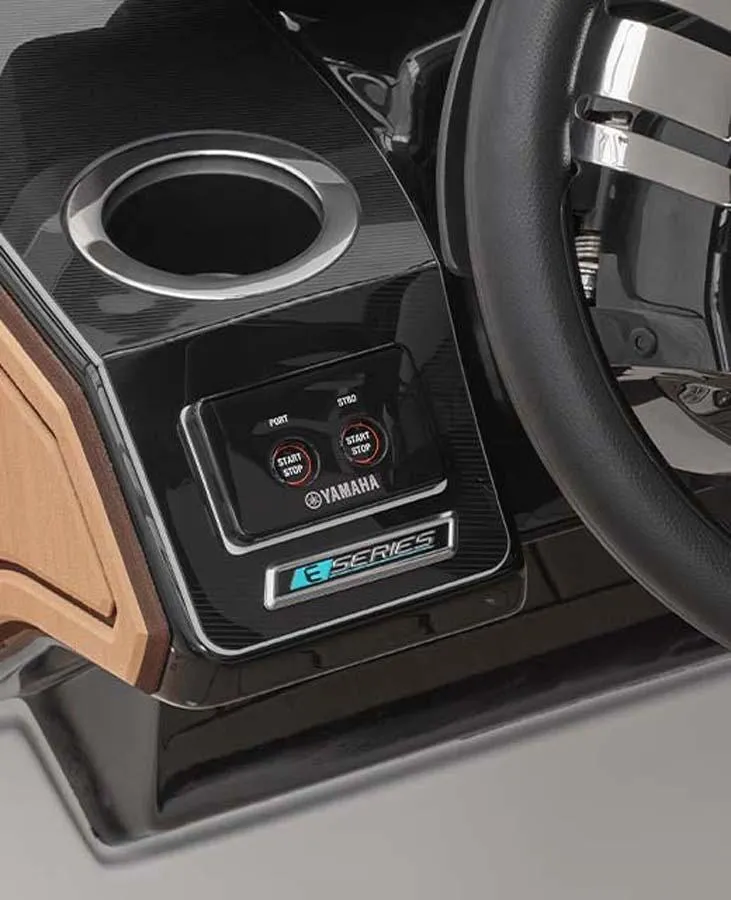 Slide: The Image of 2023 Yamaha Boats 252SD dashboard with start/stop buttons and cup holder. - 8