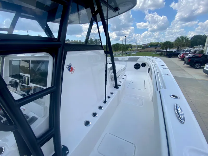 Slide: The Image of 2022 Invincible 35 Catamaran boat deck with rod holders and seating area. - 25