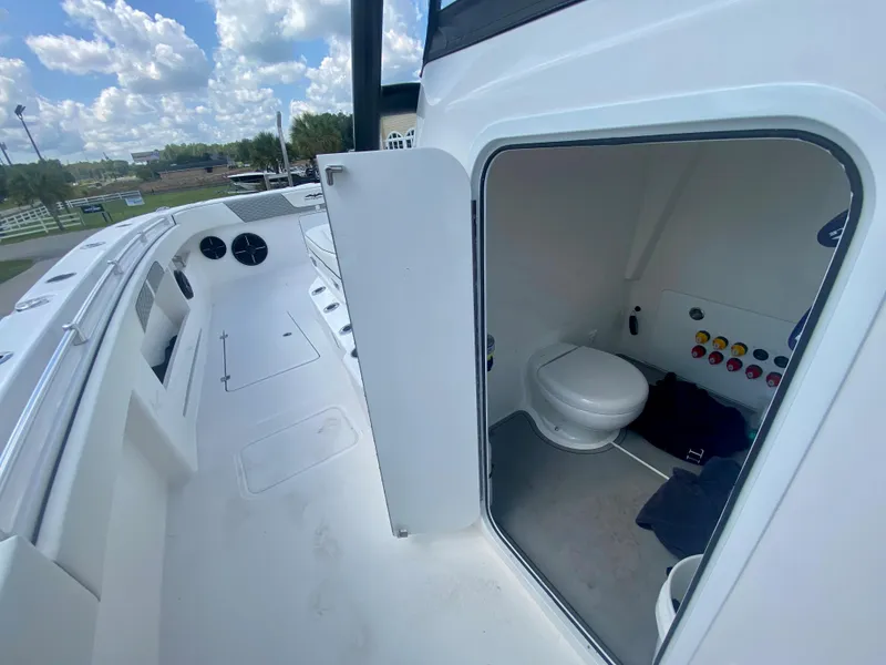 Slide: The Image of 2022 Invincible 35 Catamaran interior with open door to bathroom. - 26