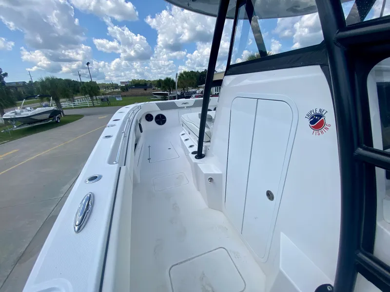 Slide: The Image of 2022 Invincible 35 Catamaran boat deck with storage compartments and seating. - 28